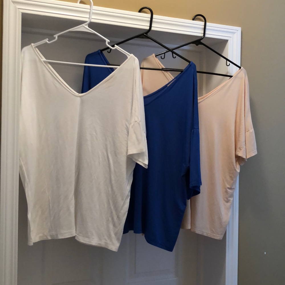 Three v neck pikos. In good condition.